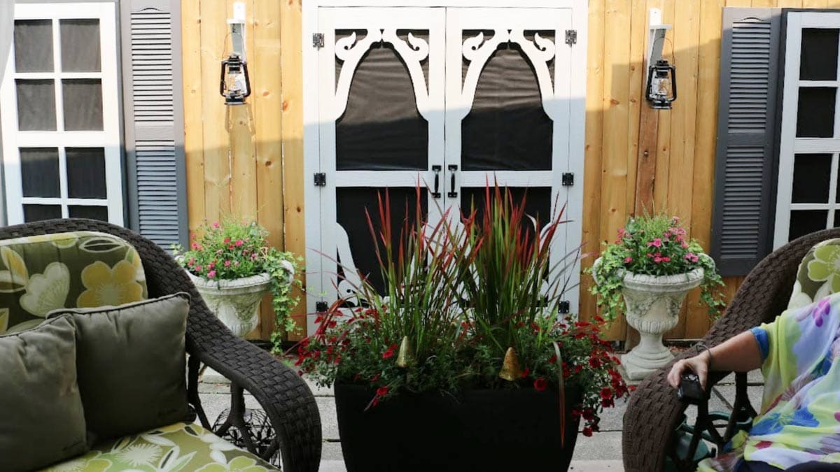 Faux doors and windows on garden fence.